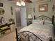 Cozy bedroom with a wrought iron bed frame and decorative accents throughout at 490 Deberry Rd, Mount Gilead, NC 27306