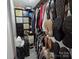 Organized walk-in closet with ample storage for clothing and accessories at 490 Deberry Rd, Mount Gilead, NC 27306