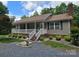 Charming single-story home with a brick foundation and a spacious, inviting front porch at 490 Deberry Rd, Mount Gilead, NC 27306
