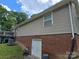 Exterior view of a home showing the brick foundation and siding at 490 Deberry Rd, Mount Gilead, NC 27306
