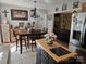 Bright kitchen featuring a dining area, stainless steel refrigerator, central island and view into the living room at 490 Deberry Rd, Mount Gilead, NC 27306