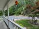Scenic view of the front yard and driveway from the covered front porch, ideal for relaxing outdoors at 490 Deberry Rd, Mount Gilead, NC 27306