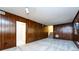 Finished basement area with wood paneling, offering versatile living space at 509 Selkirk Pl, Charlotte, NC 28270