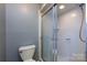 Bathroom featuring a toilet and shower, showcasing clean design and functionality at 509 Selkirk Pl, Charlotte, NC 28270