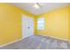 Bright bedroom with a ceiling fan, closet, and a window allowing for natural light at 509 Selkirk Pl, Charlotte, NC 28270