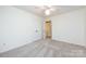 Neutral bedroom featuring a ceiling fan, plush carpeting, and an ensuite bathroom for added convenience at 509 Selkirk Pl, Charlotte, NC 28270