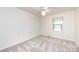 Bright bedroom with neutral walls, neutral carpet, and a window offering a versatile space at 509 Selkirk Pl, Charlotte, NC 28270