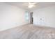 Bright bedroom with double closets, a window, neutral walls, and neutral carpet, offering a versatile space at 509 Selkirk Pl, Charlotte, NC 28270