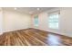 Spacious bedroom featuring hardwood floors and windows with natural light at 509 Selkirk Pl, Charlotte, NC 28270