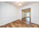 Bright dining room with chair railing and a contemporary light fixture at 509 Selkirk Pl, Charlotte, NC 28270