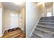 Welcoming foyer with hardwood floors and a staircase, offering access to the front door at 509 Selkirk Pl, Charlotte, NC 28270