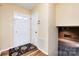 Bright foyer with hardwood flooring and a view of the living room featuring a fireplace at 509 Selkirk Pl, Charlotte, NC 28270