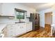 Sunny eat in kitchen with stainless steel fridge at 509 Selkirk Pl, Charlotte, NC 28270
