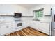 Eat in kitchen with white cabinets and stainless steel microwave at 509 Selkirk Pl, Charlotte, NC 28270