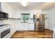Efficient kitchen design featuring stainless steel appliances and white cabinetry at 509 Selkirk Pl, Charlotte, NC 28270