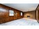 Spacious living room with wood paneled walls and a charming fireplace at 509 Selkirk Pl, Charlotte, NC 28270
