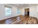 Open living room with hardwood floors, ample natural light, and neutral paint at 509 Selkirk Pl, Charlotte, NC 28270