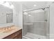 A well-appointed bathroom features a glass-enclosed shower and a marble vanity at 518 Westside Cir, China Grove, NC 28023