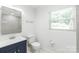 Modern bathroom featuring a stylish vanity with a vessel sink and tiled shower, plus window at 518 Westside Cir, China Grove, NC 28023