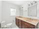 A well-lit bathroom boasts a double vanity with marble countertop and ample storage at 518 Westside Cir, China Grove, NC 28023