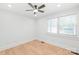 A comfortable bedroom with laminate flooring has neutral walls and a large window at 518 Westside Cir, China Grove, NC 28023