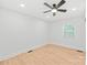 A cozy bedroom features neutral walls, laminate floors, a ceiling fan and natural light at 518 Westside Cir, China Grove, NC 28023
