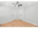 A spacious bedroom with neutral walls, laminate floors and ceiling fan offers comfort at 518 Westside Cir, China Grove, NC 28023