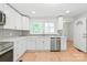 A modern kitchen with stainless steel appliances, and stylish backsplash at 518 Westside Cir, China Grove, NC 28023