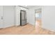 A bright kitchen with stainless steel refrigerator and ample storage in white cabinets at 518 Westside Cir, China Grove, NC 28023