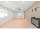 Spacious living room featuring modern lighting, a ceiling fan, and a cozy fireplace at 518 Westside Cir, China Grove, NC 28023
