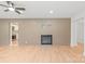Cozy living room featuring a brick accent wall, fireplace, and an open entryway at 518 Westside Cir, China Grove, NC 28023