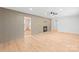 A bright living room with brick accent wall, fireplace, and new floors at 518 Westside Cir, China Grove, NC 28023