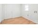 A tidy mud room features laminate flooring and access to an exterior door, with a window for natural light at 518 Westside Cir, China Grove, NC 28023