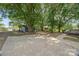 A concrete area and small shed can be seen in the expansive back yard at 5200 Winding Ln, Indian Trail, NC 28079