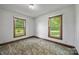 A bedroom with two windows which lets in natural light creating a relaxing atmosphere at 5200 Winding Ln, Indian Trail, NC 28079