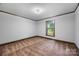 Bright bedroom filled with natural light from a window, creating a peaceful and inviting atmosphere at 5200 Winding Ln, Indian Trail, NC 28079