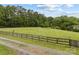 A wooden fence borders the front yard of this property at 5200 Winding Ln, Indian Trail, NC 28079