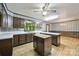 Bright eat-in kitchen showcases white counters, wooden floor, and ample space for food preparation and dining at 5200 Winding Ln, Indian Trail, NC 28079