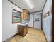 Mudroom features a sink, wood cabinets, and an exterior door that provides convenience and functionality at 5200 Winding Ln, Indian Trail, NC 28079