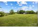 The front yard of the home displays ample green space and well maintained lawn at 5200 Winding Ln, Indian Trail, NC 28079