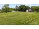 The front yard of the home displays ample green space and well maintained lawn at 5200 Winding Ln, Indian Trail, NC 28079