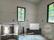 Bathroom with two windows and design details for the tile backsplash and countertop at 5427 Addison Dr, Charlotte, NC 28211
