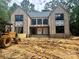 Exterior of the home under construction, showcasing the brick facade and window placements at 5427 Addison Dr, Charlotte, NC 28211