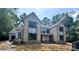 Front exterior of a new construction home with brick facade and covered entrance at 5427 Addison Dr, Charlotte, NC 28211