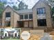 Charming brick home with a mixture of modern and classic elements, including a rendering and color swatches at 5427 Addison Dr, Charlotte, NC 28211