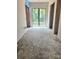 Spacious hallway features a large window, a view outdoors, and the walls are under construction at 5427 Addison Dr, Charlotte, NC 28211