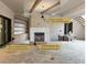 Living room with fluted marble fireplace, white oak beams, and built-in shelves at 5427 Addison Dr, Charlotte, NC 28211