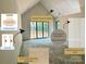 Living room features vaulted ceiling trim detail, ceiling fixture, and sconces at 5427 Addison Dr, Charlotte, NC 28211