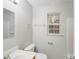 Bright bathroom with modern fixtures, a single vanity, and a window providing natural light at 6216 Bandy Dr, Charlotte, NC 28227