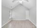 Bright bedroom with new flooring, fresh paint, and a view of the yard at 6216 Bandy Dr, Charlotte, NC 28227